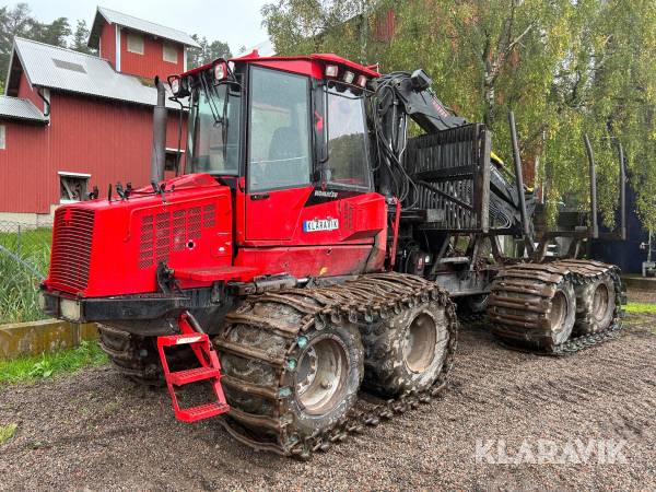 Skotare Komatsu 840TX med skogskärra & gripar