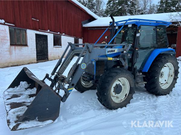 Traktor New Holland TS100 med skopa & gafflar