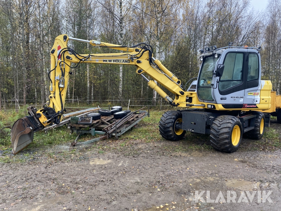 Grävmaskin New Holland MH3,6 med tippvagn