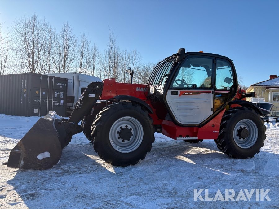 Teleskoplastare Manitou MT733 med skopa och gafflar