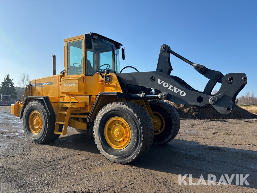 Hjullastare Volvo L90C med planeringsskopa