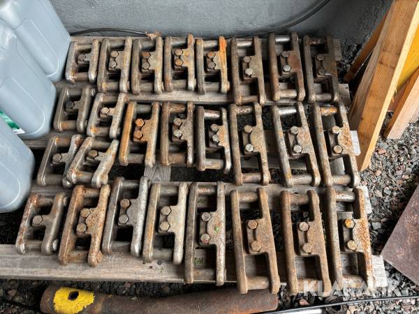 Bandlås för skogsmaskin