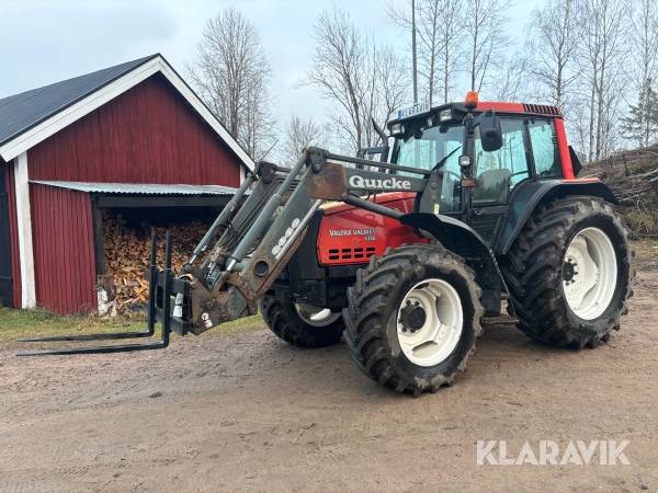 Traktor Valtra Valmet 6350 med gafflar och skopa