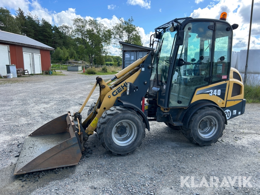 Hjullastare Gehl 340 med pallgafflar och skopa