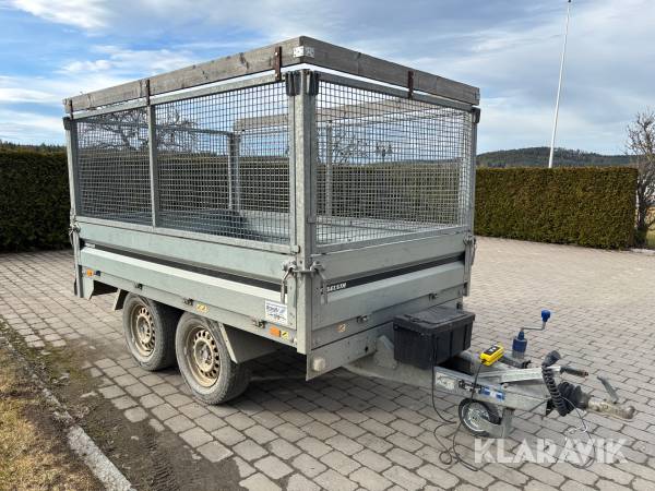 Personbilssläp Thule med gallergrindar och hydraulisk tipp