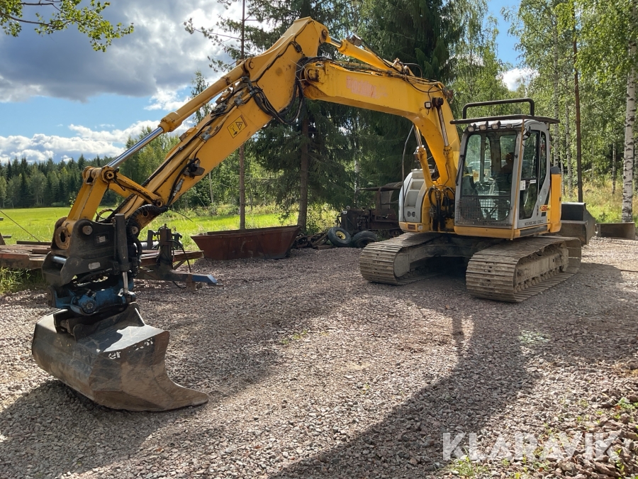 Grävmaskin New Holland Kobelco E 135 BSR-2 med mycket redskap