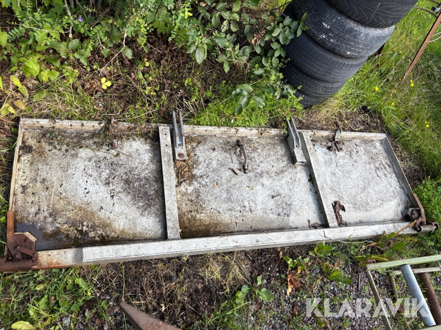 Bakläm/spridarlucka