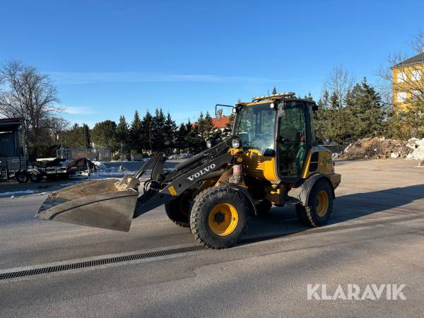 Hjullastare Volvo L25HS med planeringsskopa och gafflar