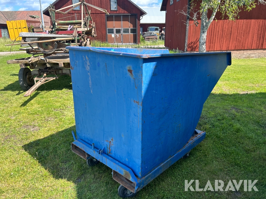 Självtömmande container