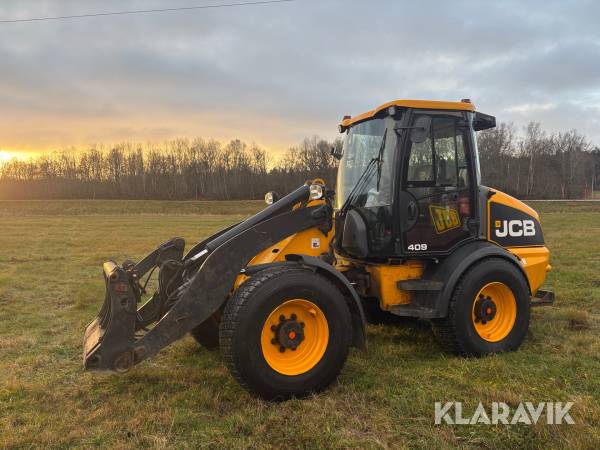 Hjullastare JCB 409 med flera redskap