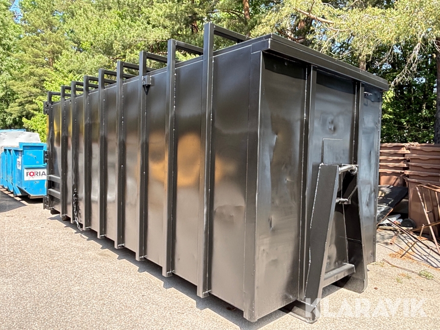 Lastväxlarcontainer komprimator