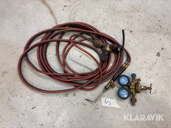 Gasslang med munstycke och gasklockor