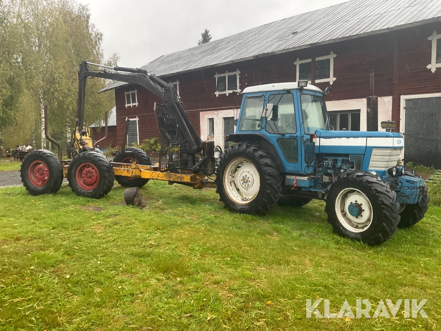 Traktor Ford 7710 med skogsvagn