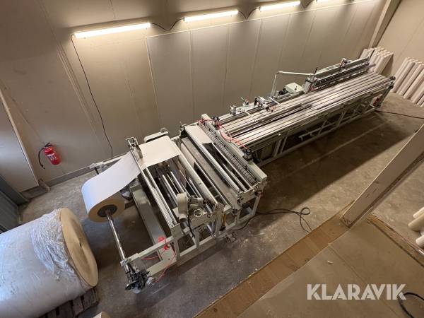 Automatisk papphylsmaskin