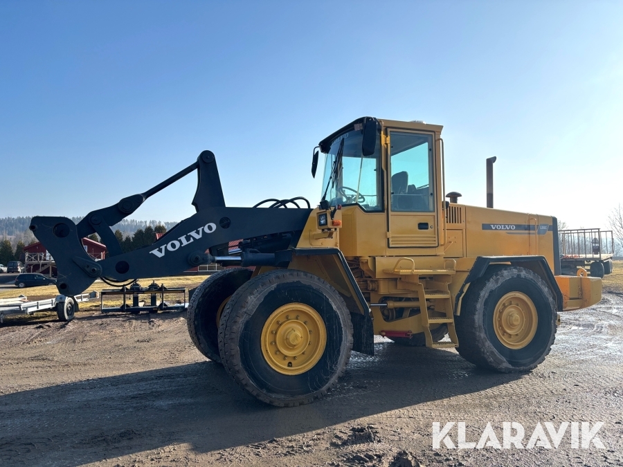 Hjullastare Volvo L90C med planeringsskopa