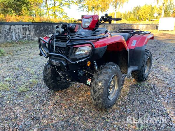 ATV Honda Rubicon med flera redskap