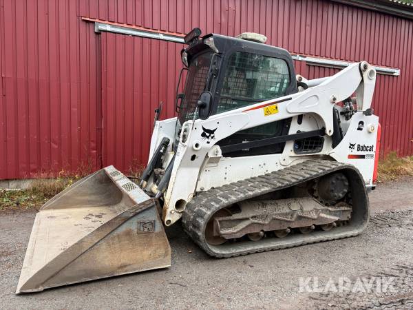 Kompaktlastare Bobcat T770 med skopa och gafflar