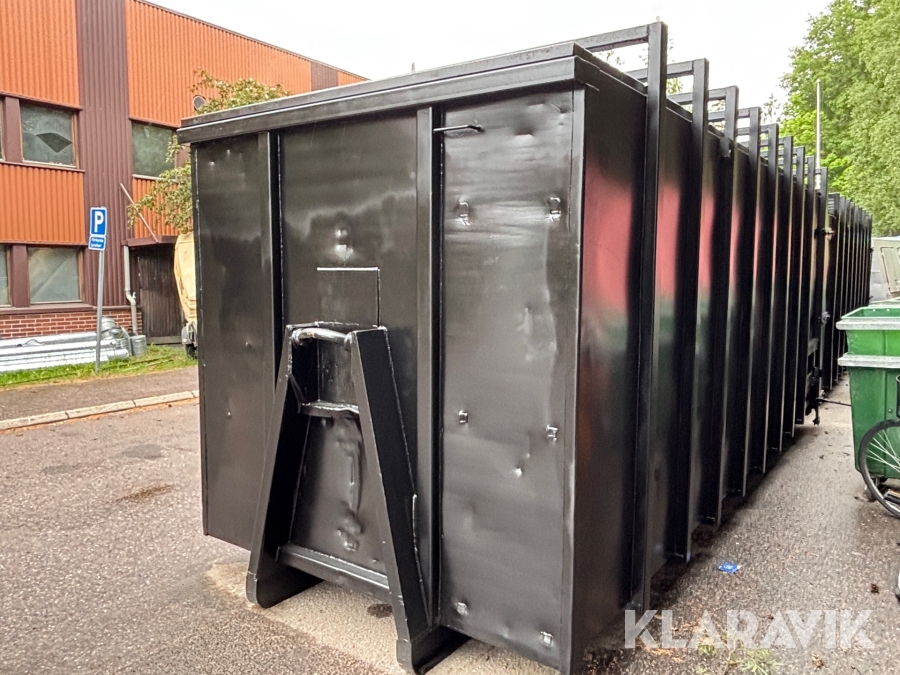 Lastväxlarcontainer komprimator