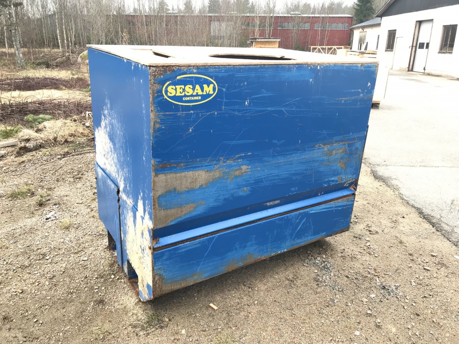 Container med öppningsbar botten för truck med gaffelspridning.
