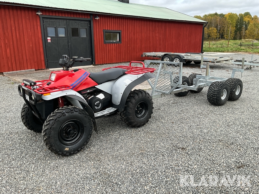 ATV Polaris BIG BOSS 4X4 400 med timmerkärra