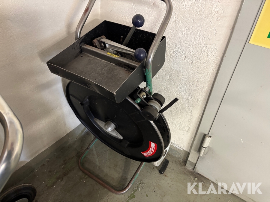 Bandningsmaskin Signode för stålband med tång.