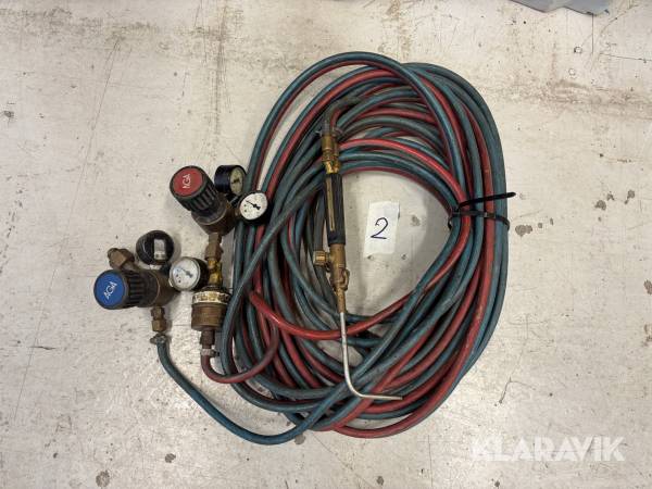 Gasslang med munstycke och gasklockor