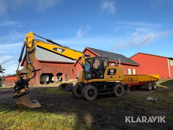 Grävmaskin CAT M316F med vagn och många redskap