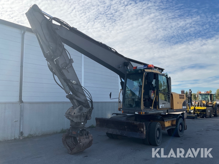 Materialhanterare Volvo EW180C med höjbar hytt