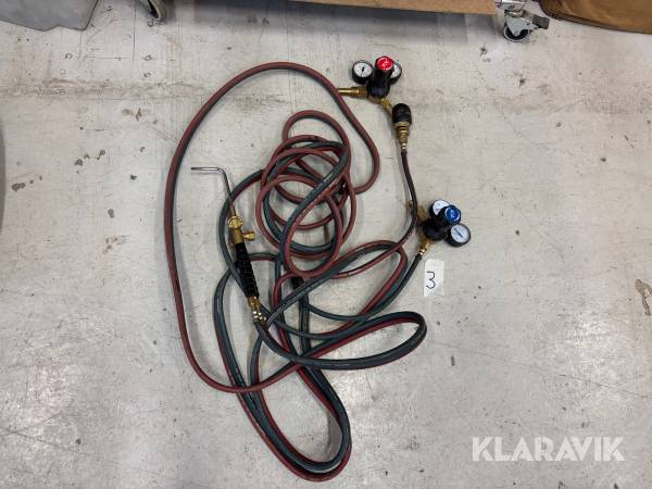 Gasslang med munstycke och gasklockor