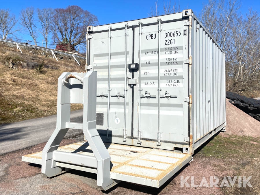 Container med lastväxlarram inklusive innehåll