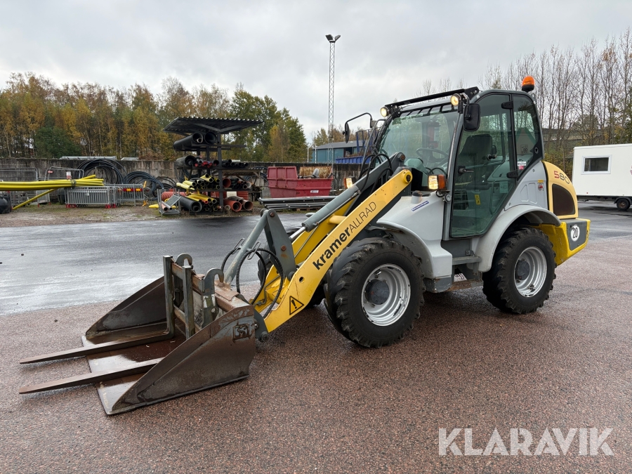 Hjullastare Kramer 580 med skopa och gafflar