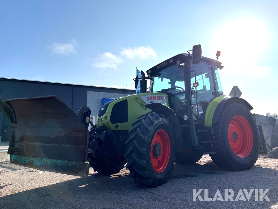 Traktor Claas A21 Arion 410 med vikplog och sandspridare