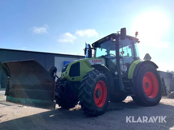 Traktor Claas A21 Arion 410 med vikplog och sandspridare