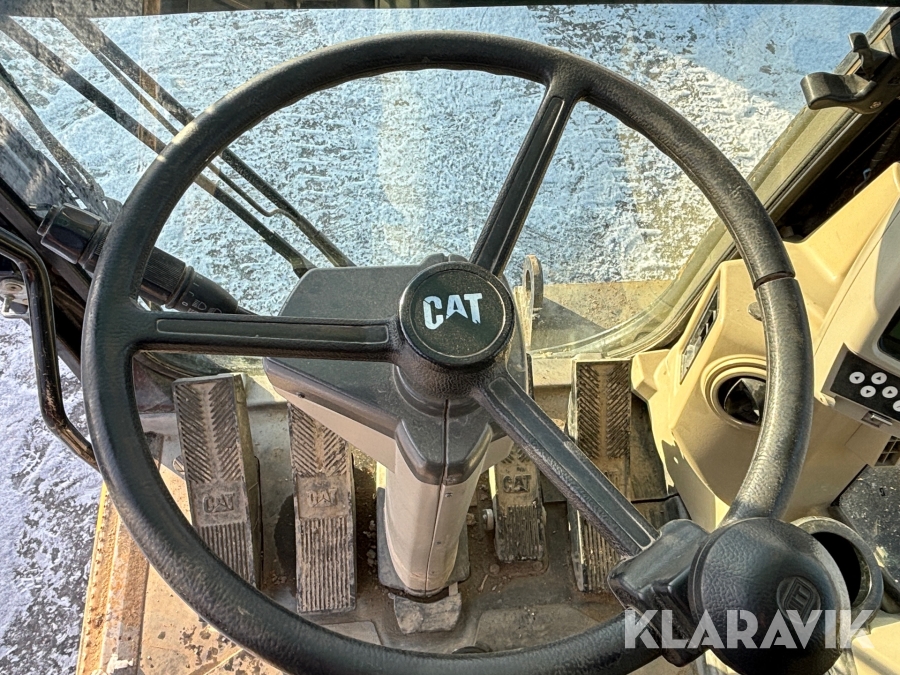 Hjulgrävare CAT M313C med tiltrotator och skopa
