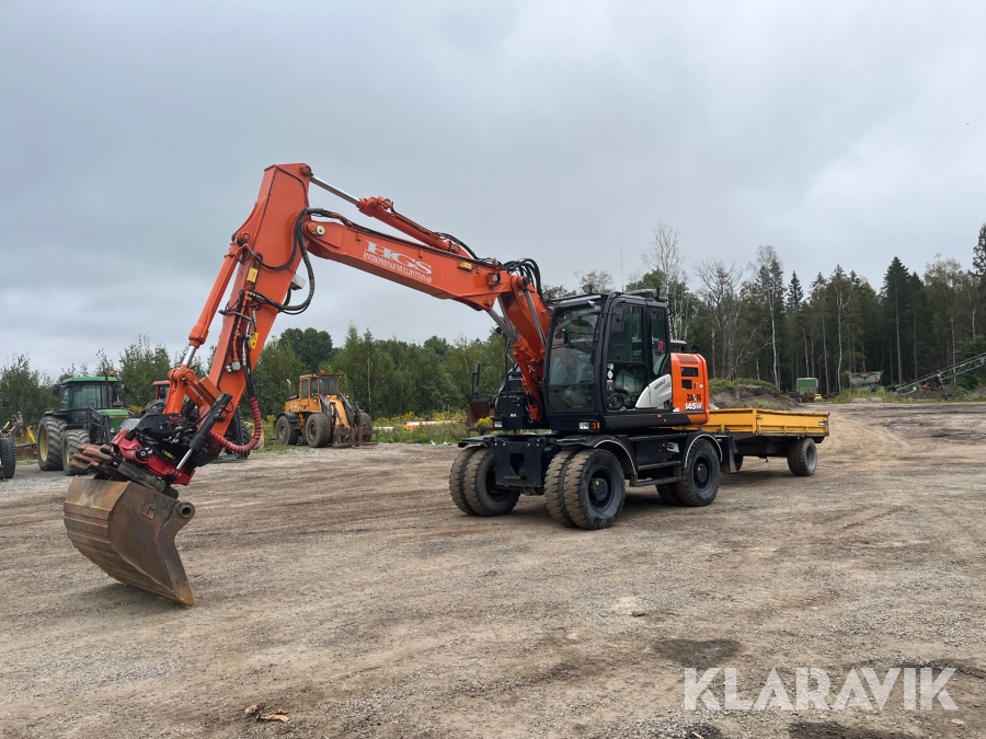 Hjulgrävare Hitachi ZX145W-6 med kärra och flera redskap